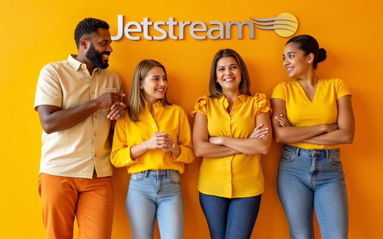 Four happy JetStream employees hanging out, socially.